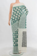 Cream Pochampally Cotton Saree with Ikat Print on the body and Ikat Border.  displayed on a mannequin