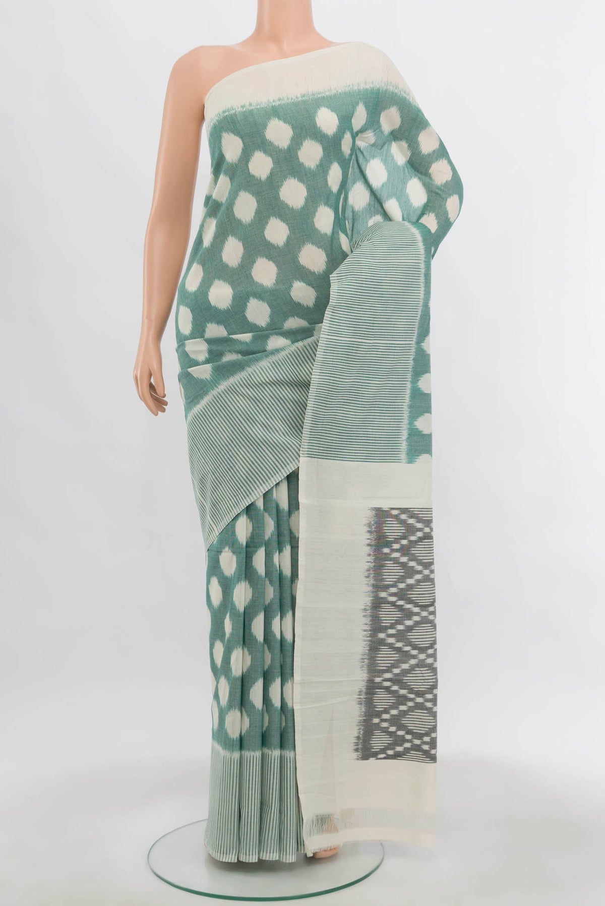 Cream Pochampally Cotton Saree with Ikat Print on the body and Ikat Border.  displayed on a mannequin
