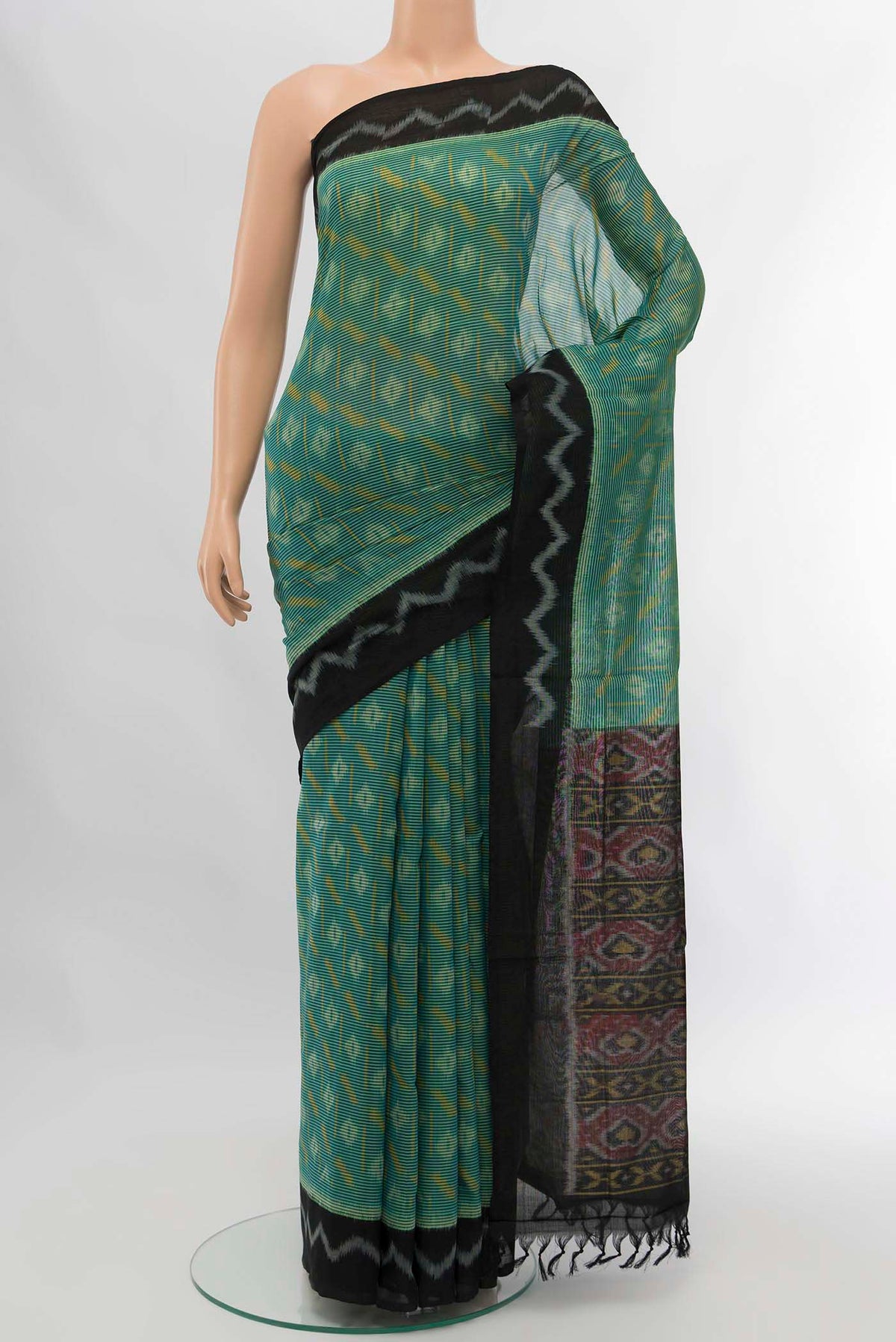 Blue Pochampally Cotton Saree with Pure Ikat on the body and Plain Border displayed on a mannequin