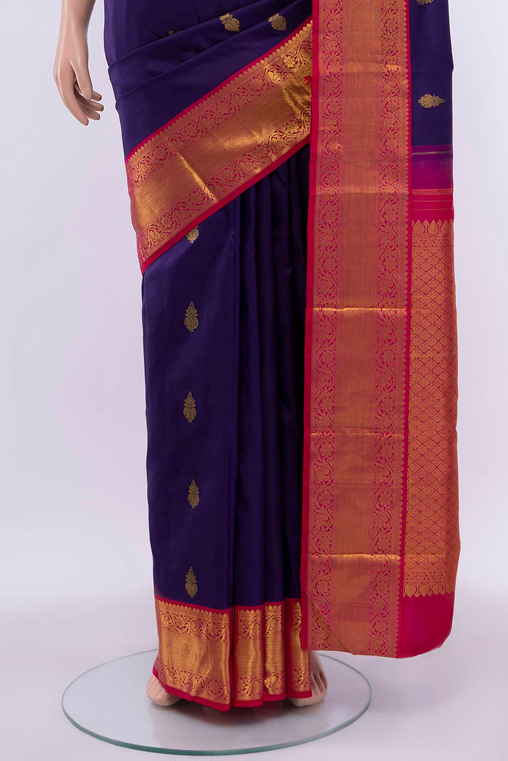 Pleats and pallu of Navy Blue Kanchipuram Silk Saree with Zari Butta on the body and Zari Border