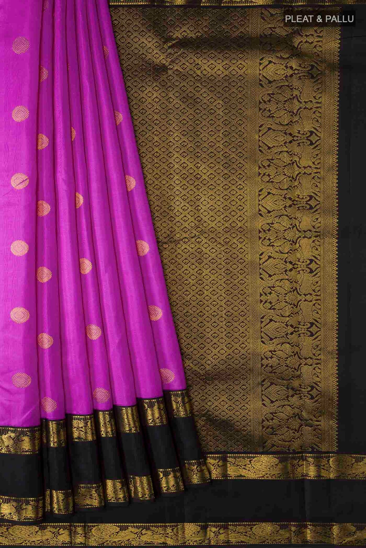 Pleats and pallu of Violet Kanchipuram Silk Saree with Zari Butta on the body and Zari Border