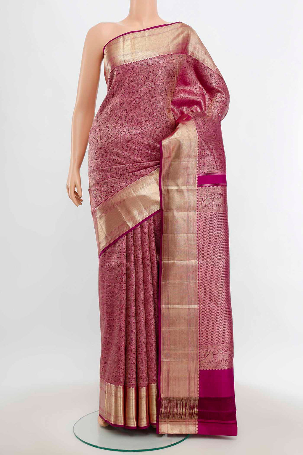 Purple Kanchipuram Silk Saree with Zari Butta on the body and Silk Border.  displayed on a mannequin