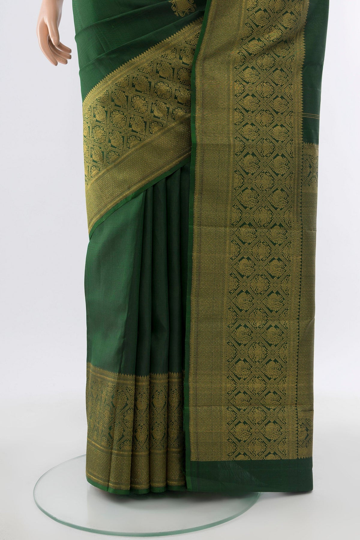 Pleats and pallu of Pure Silk Pure Zari Bottle Green Kanjivaram Saree with Zari Butta on the body and Silk Border. 