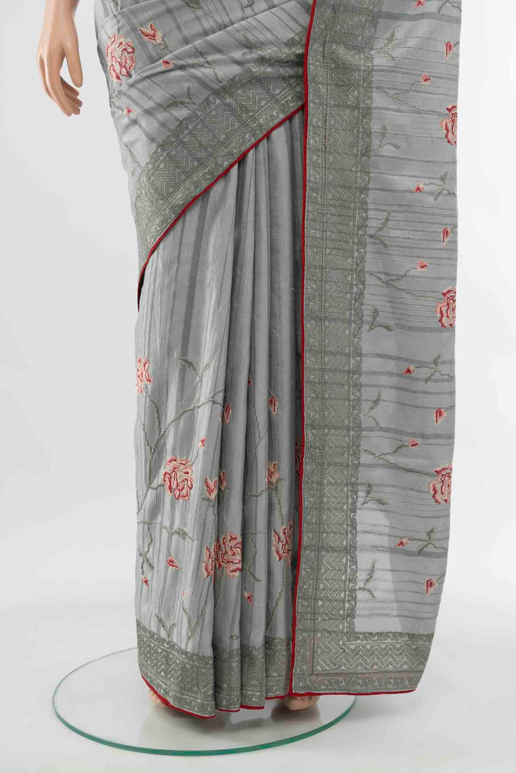 Pleats and pallu of Grey Art Silk Saree with Embroidery on the body and Silk Border