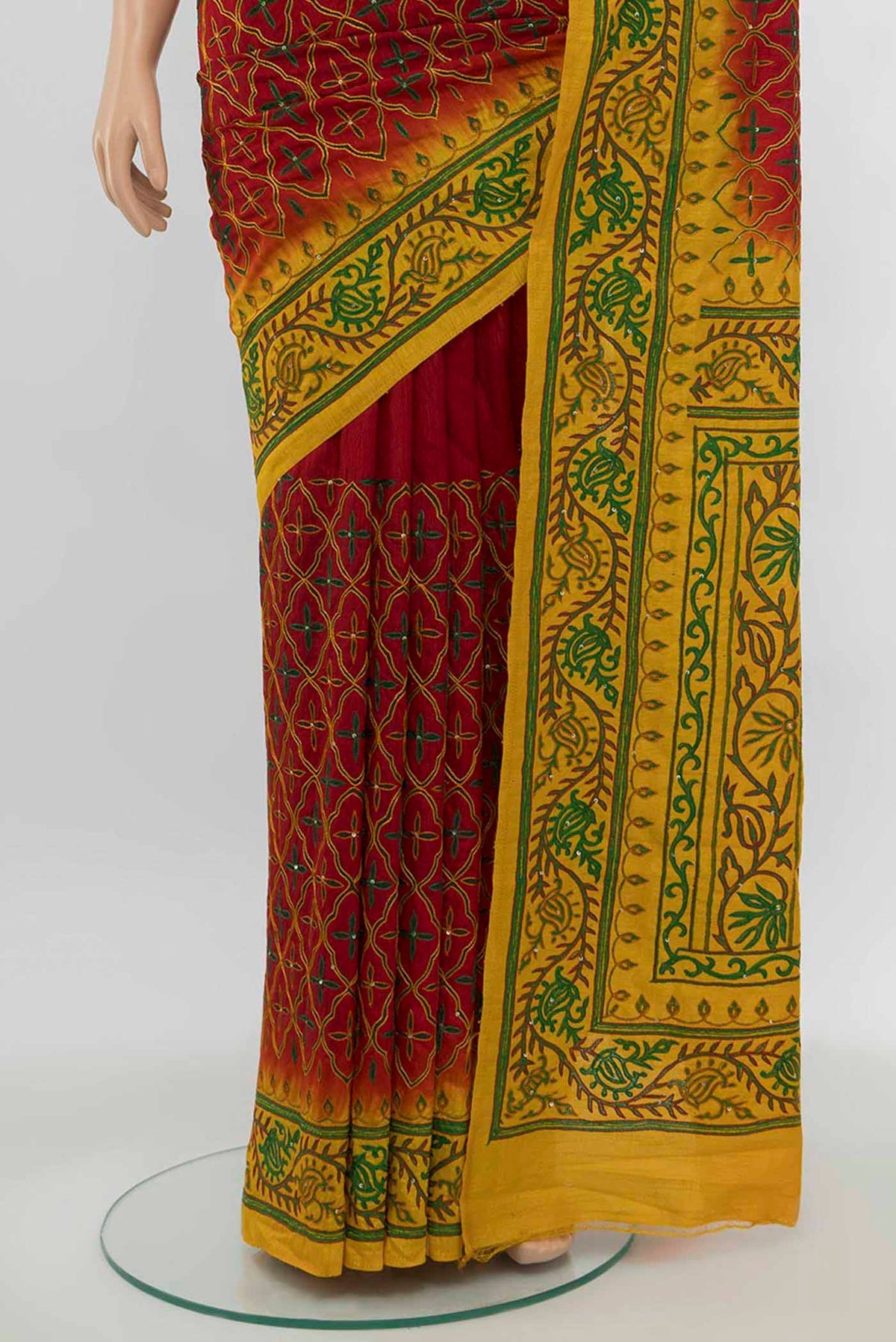 Pleats and pallu of Maroon Art Silk Saree with Embroidery on the body and Silk Border. 
