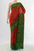 Red Blended Raw Silk Saree with Embroidery on the body and Embroidery Border displayed on a mannequin