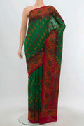 Bottle Green Art Silk Saree with Embroidery on the body and Embroidery Border.  displayed on a mannequin