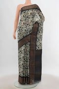 Multi Color Tussar Silk Saree with Zari Butta on the body and Silk Border.  displayed on a mannequin