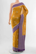 Yellow Blended Art Silk Saree with Zari Butta on the body and Zari Border displayed on a mannequin