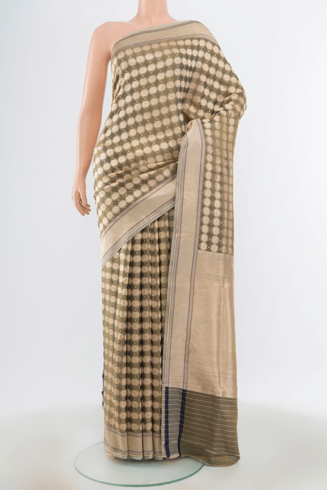 Olive Green Banarasi Silk Saree with Zari Butta on the body and Zari Border.  displayed on a mannequin