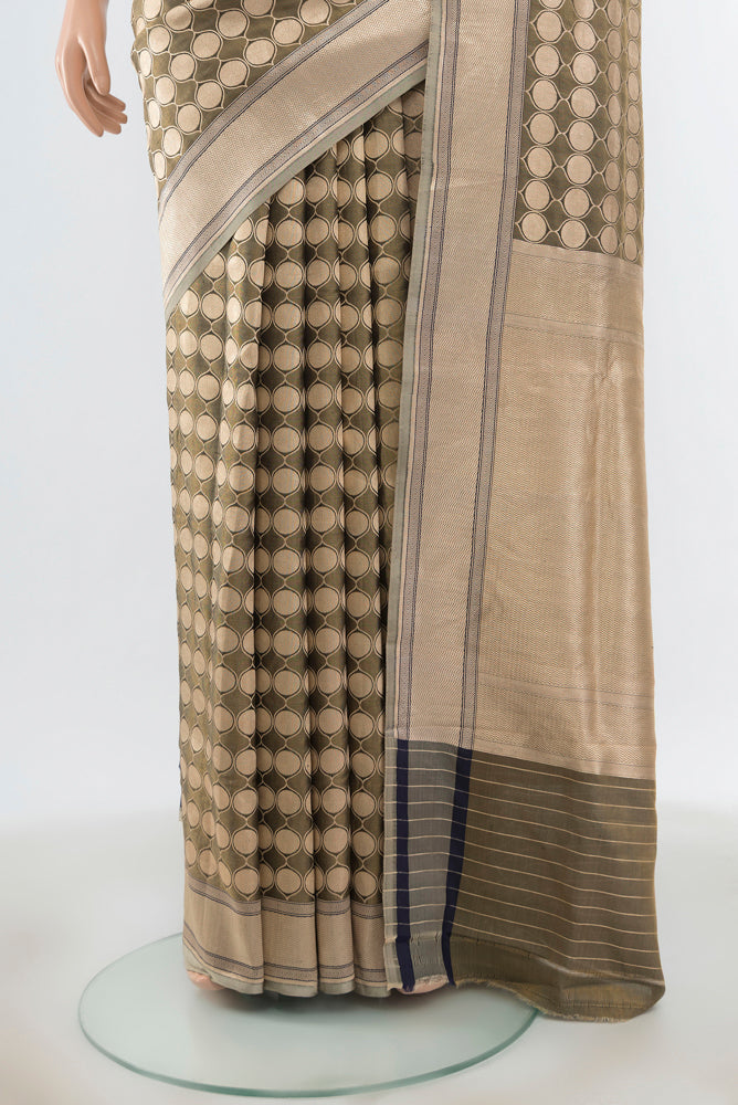 Pleats and pallu of Olive Green Banarasi Silk Saree with Zari Butta on the body and Zari Border. 