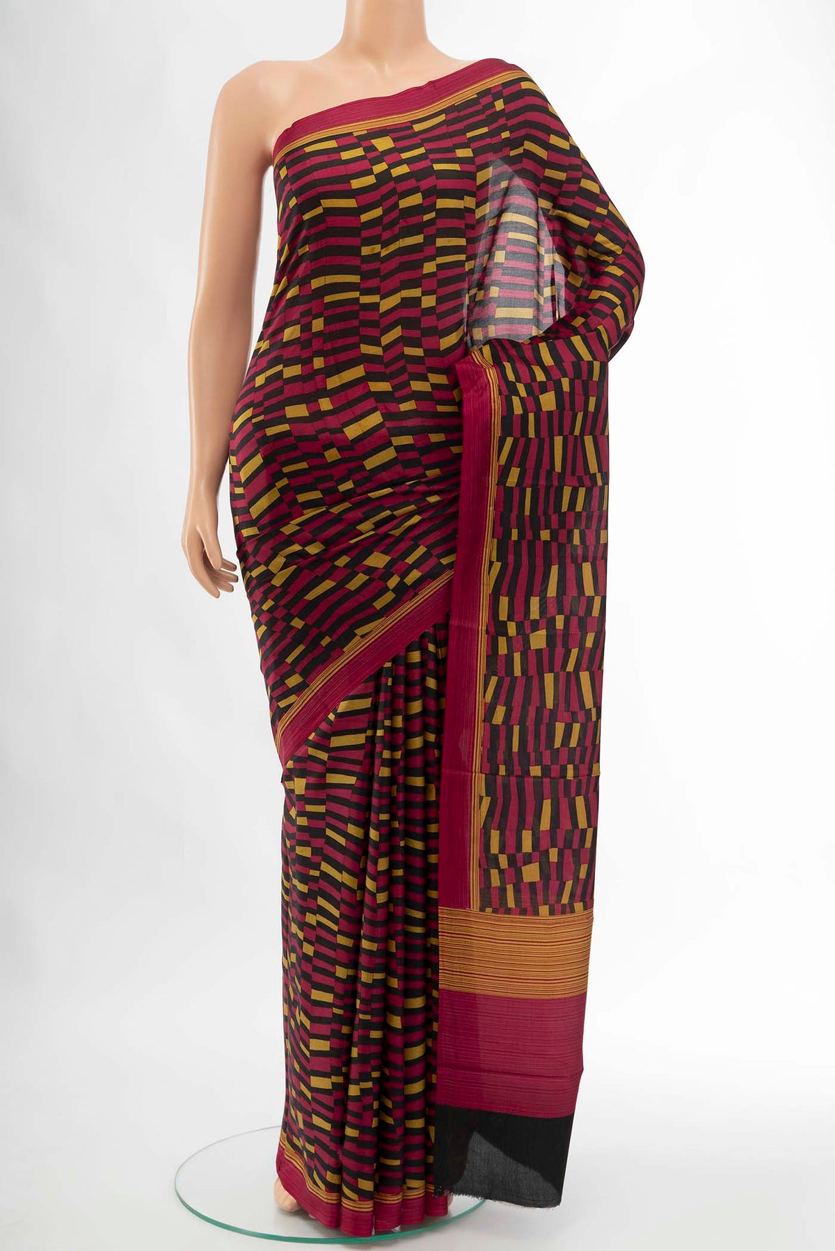 Black Printed Silk Saree with Floral Print on the body and Fancy Border displayed on a mannequin
