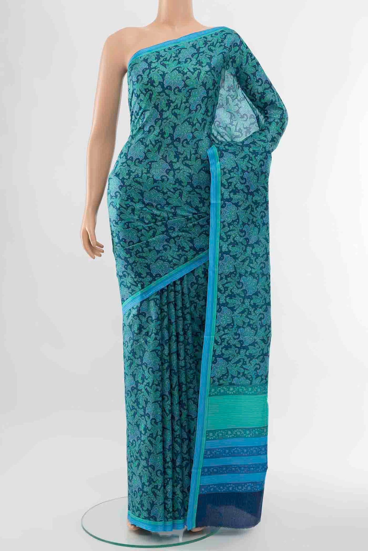 Light Green Printed Silk Saree with Floral Print on the body and Plain Border displayed on a mannequin