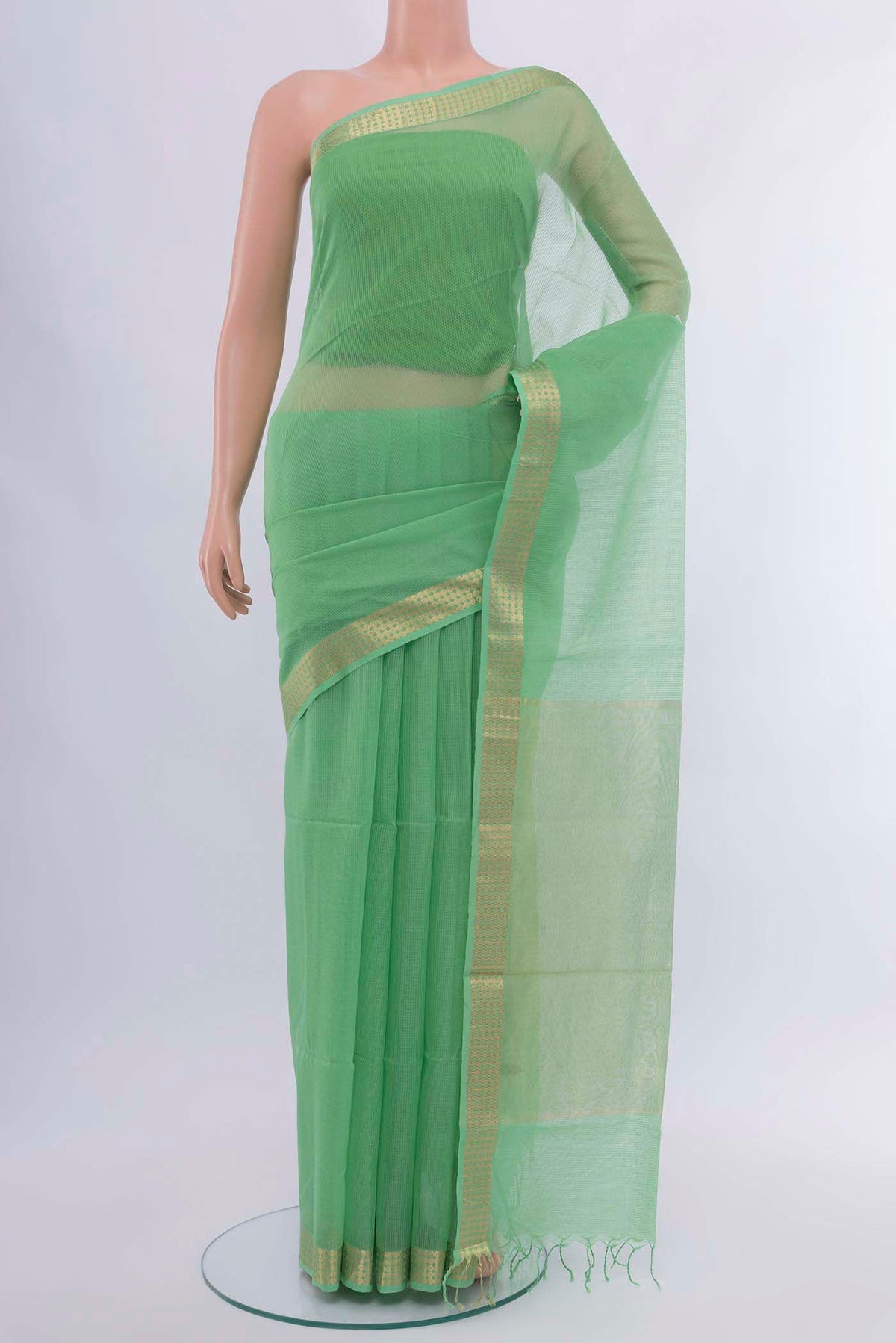 Light Green Maheshwari Silk Cotton Saree with Zari Butta on the body and Silk Border displayed on a mannequin