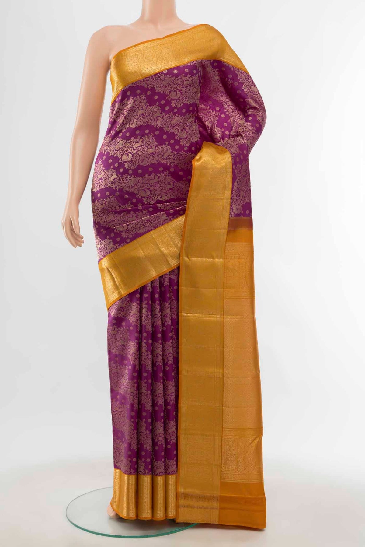 Magenta Kanchipuram Silk Saree with Zari Butta on the body and Silk Border displayed on a mannequin