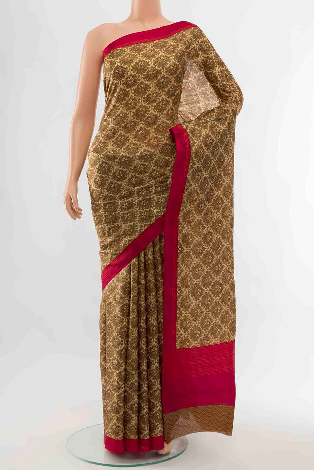 Bronze Printed Silk Saree with Floral Print on the body and Fancy Border displayed on a mannequin