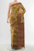 Mustard Tussar Silk Saree with Printed design on the body and Embroidery Border displayed on a mannequin