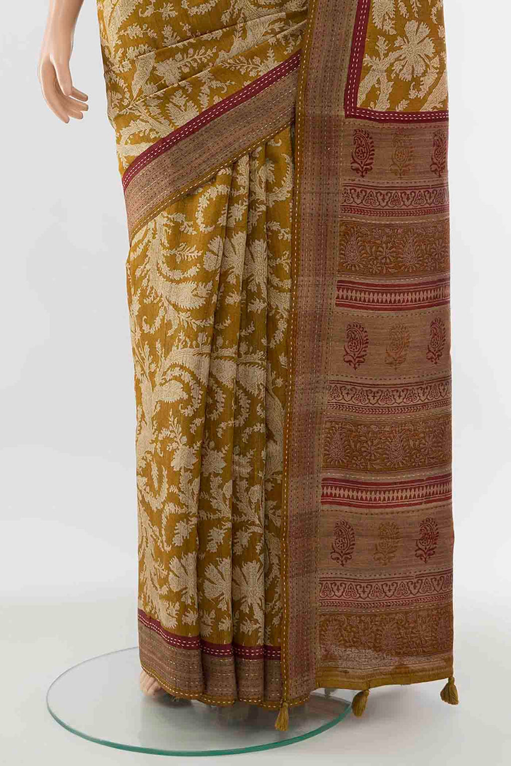 Pleats and pallu of Mustard Tussar Silk Saree with Printed design on the body and Embroidery Border