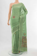 Pista Green Art Silk Saree with Thread Butta on the body and Thread Border displayed on a mannequin