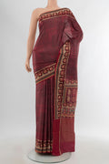 Brown Tussar Silk Saree with Printed design on the body and Printed Border.  displayed on a mannequin