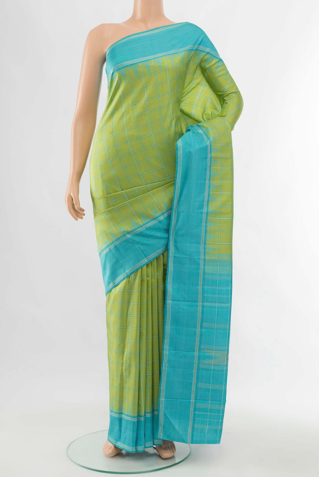 Pista Green Kanchipuram Silk Saree with Zari Butta on the body and Silk Border displayed on a mannequin