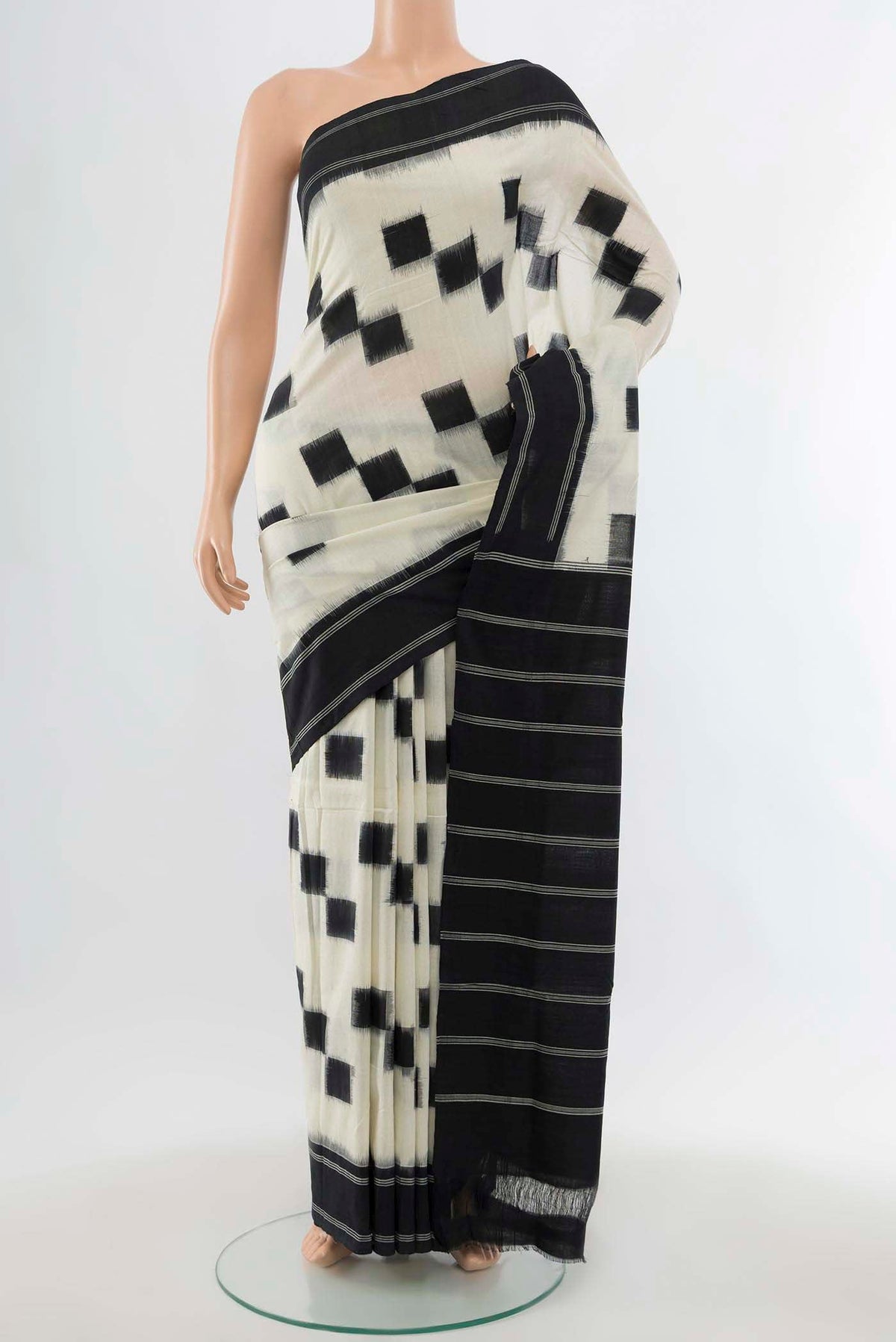 Cream Pochampally Cotton Saree with Ikat Print on the body and Fancy Border displayed on a mannequin
