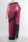 Peach Pochampally Cotton Saree with Ikat Print on the body and Fancy Border.  displayed on a mannequin