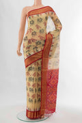 Beige Kora Cotton Saree with Batik Print on the body and Silk Border displayed on a mannequin