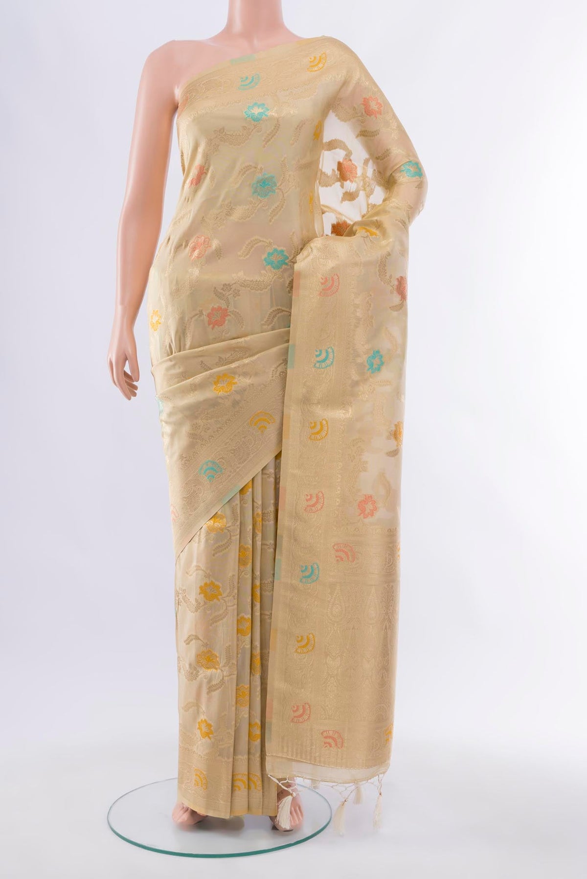 Cream Art Silk Saree with Zari Butta on the body and Silk Border displayed on a mannequin