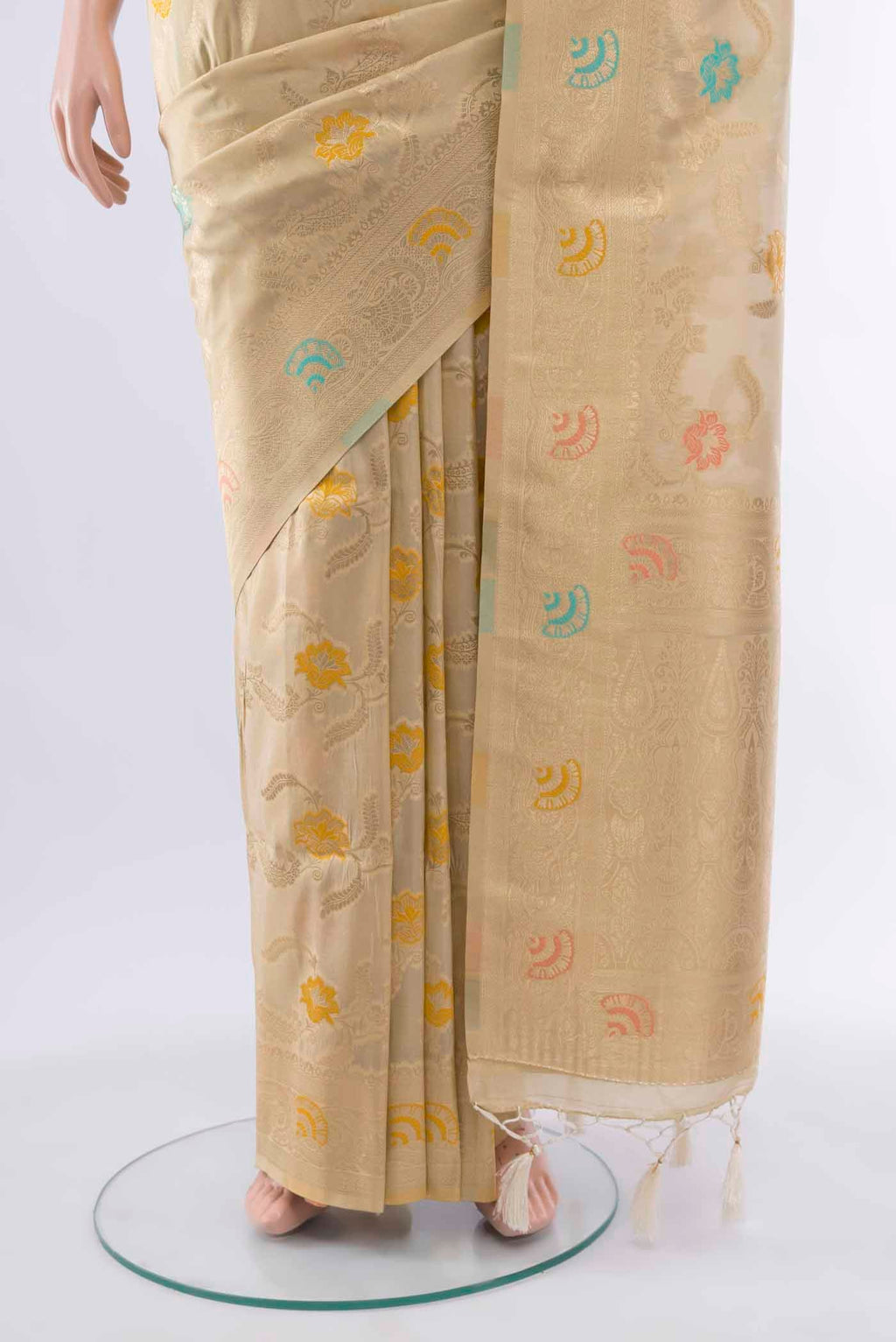 Pleats and pallu of Cream Art Silk Saree with Zari Butta on the body and Silk Border