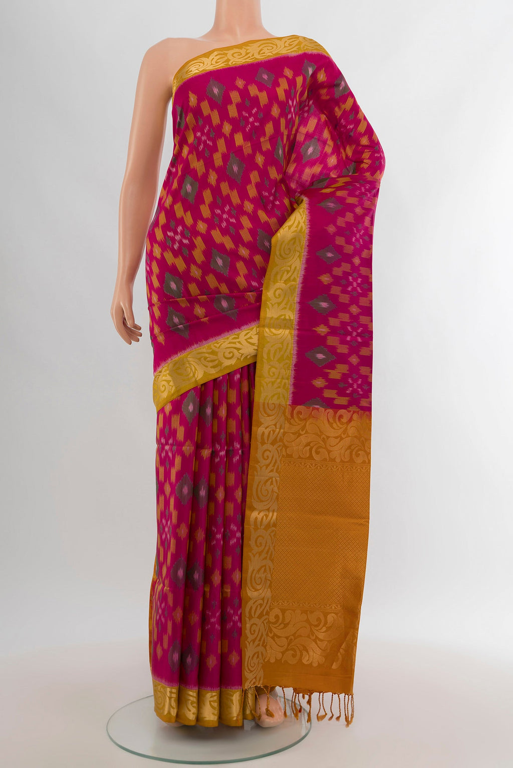 Dark Pink Soft Silk Saree with Ikat Print on the body and Zari Border.  displayed on a mannequin