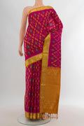 Dark Pink Soft Silk Saree with Ikat Print on the body and Zari Border.  displayed on a mannequin