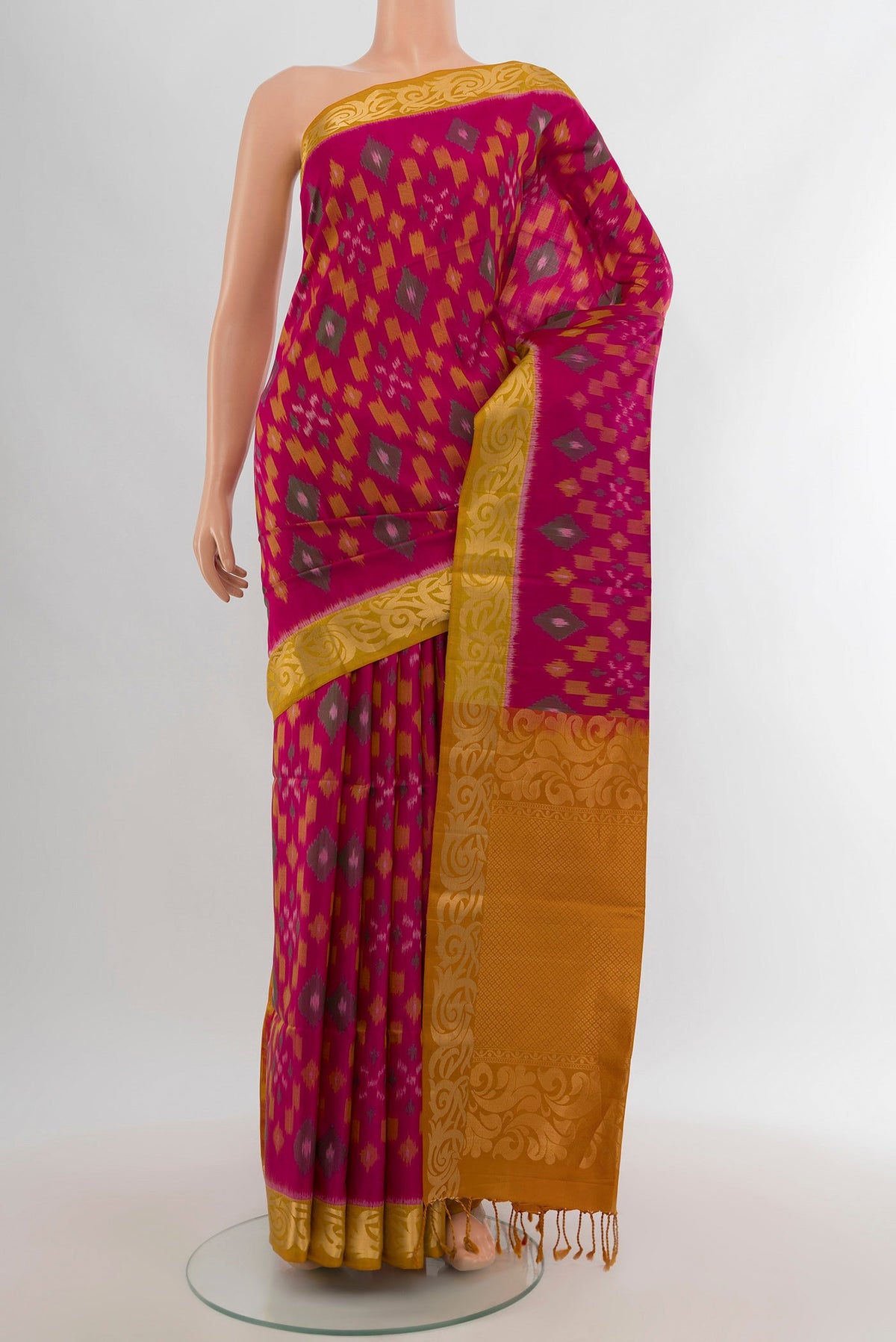 Dark Pink Soft Silk Saree with Ikat Print on the body and Zari Border.  displayed on a mannequin