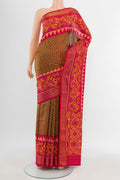 Pure Silk Pure Zari Multi Color Rajkot Patola Saree with Ikat Print on the body and Silk Border.  displayed on a mannequin
