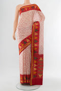 Off White Rajkot Patola Silk Saree with Batik Print on the body and Silk Border.  displayed on a mannequin