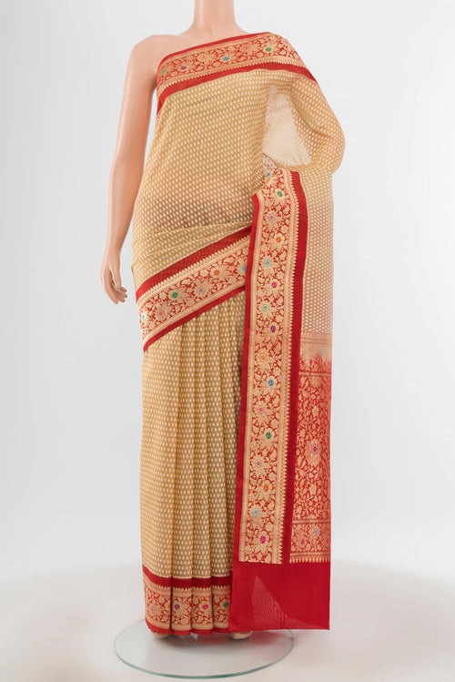 Beige Banarasi Kora Silk Saree with Zari Butta on the body and Silk Border.  displayed on a mannequin