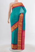 Light Blue Bangalore Silk Saree with Zari Butta on the body and Silk Border.  displayed on a mannequin