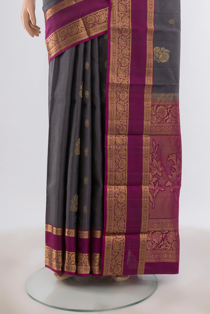 Pleats and pallu of Davys Grey Dual Tone Kanjivaram Silk Saree with Zari Butta on the body and Zari Border. 