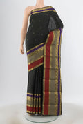 Black Kanjivaram Silk Saree with Zari Butta on the body and Silk Border.  displayed on a mannequin