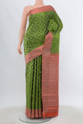 Light Green Kanjivaram Silk Saree with Zari Brocade on the body and Silk Border.  displayed on a mannequin