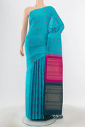 Pure Silk Pure Zari Sky Blue Kanchipuram Saree with Zari Butta on the body and Silk Border.  displayed on a mannequin