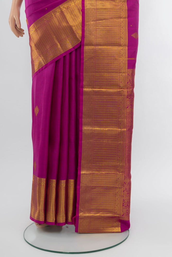 Pleats and pallu of Purple Kanjivaram Silk Saree with Zari Brocade on the body and Zari Border. 