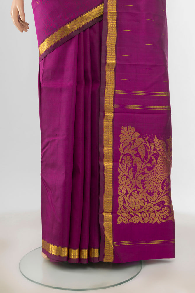 Pleats and pallu of Purple Kanjivaram Silk Saree with Zari Butta on the body and Zari Border. 