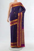 Navy Blue Kanjivaram Silk Saree with Zari Butta on the body and Silk Border.  displayed on a mannequin
