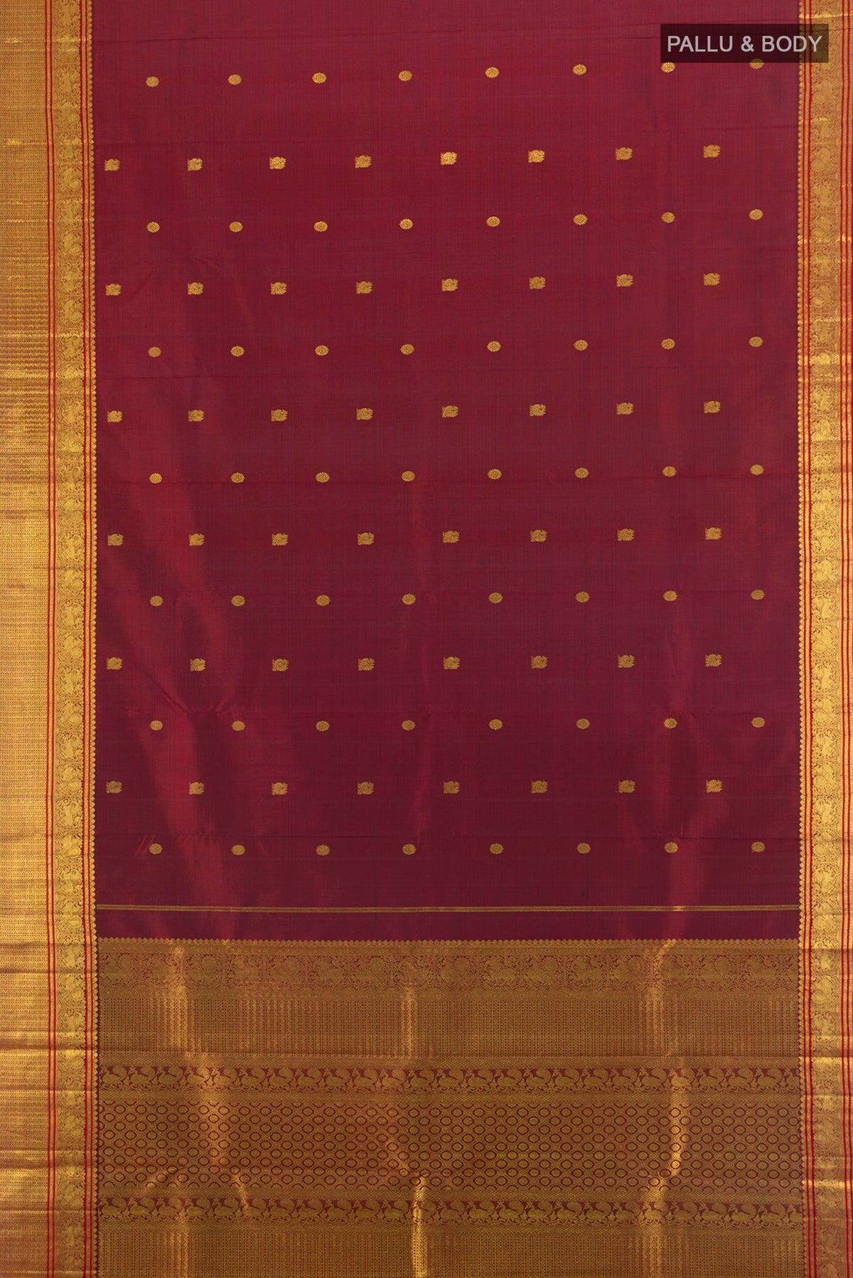 Flat view of Pure Silk Pure Zari Maroon Kanchipuram Saree with Zari Butta on the body and Zari Border. 