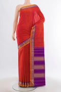 Peach Kanjivaram Silk Saree with Zari Butta on the body and Silk Border.  displayed on a mannequin