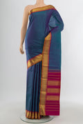 Multi Color Kanchipuram Silk Saree with Plain Body and Zari Border.  displayed on a mannequin