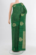 Bottle Green Kanjivaram Silk Saree with Zari Butta on the body and Silk Border.  displayed on a mannequin