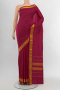Maroon Kanjivaram Silk Saree with Plain Body and Silk Border.  displayed on a mannequin