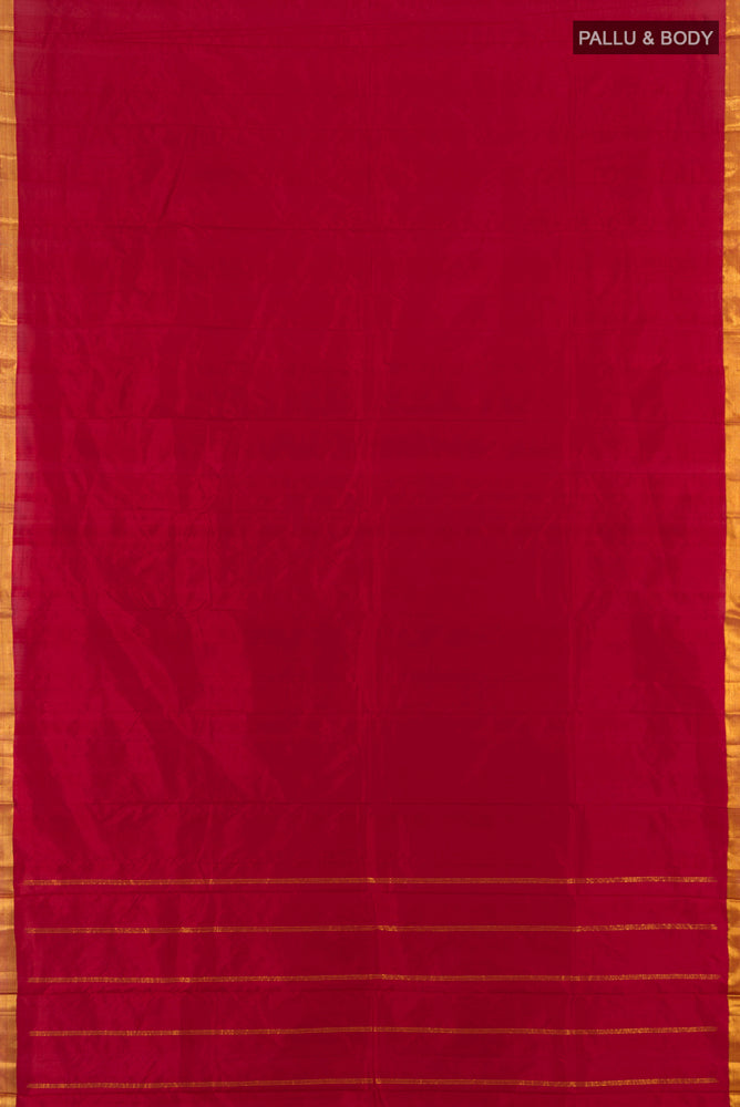 Flat view of Maroon Kanchipuram Silk Saree with Plain Body and Zari Border. 